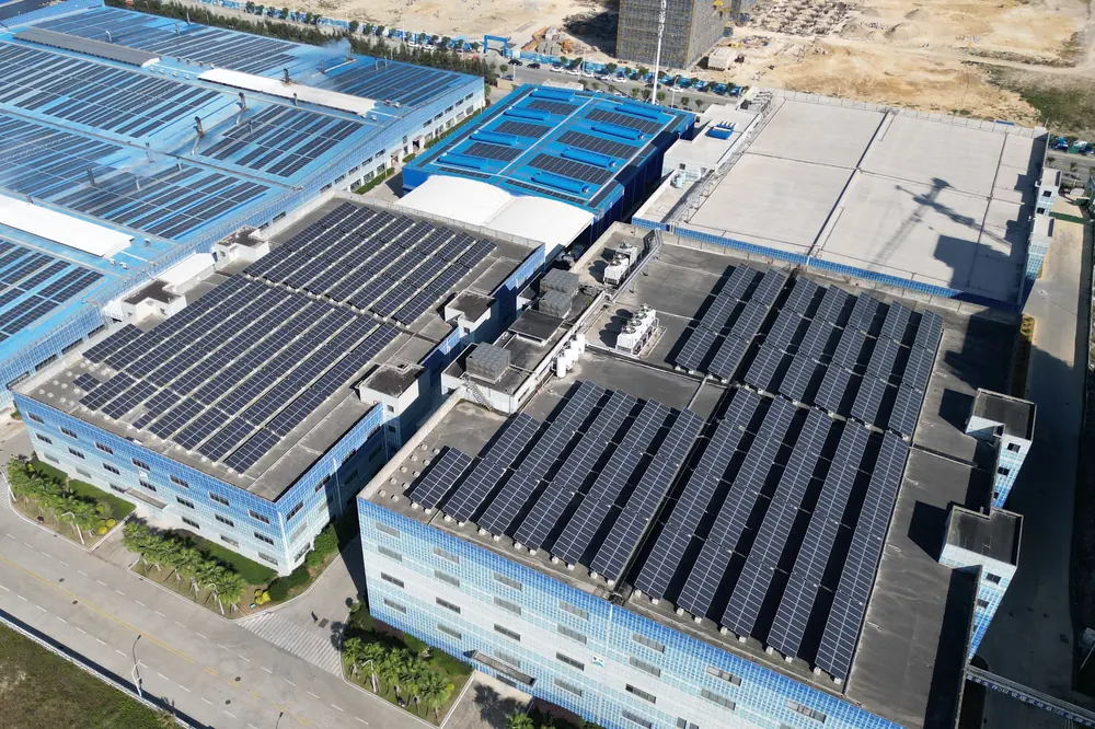 Stock photograph: aerial view of rooftop solar panels on large industrial buildings